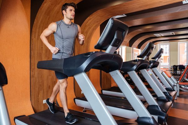 fitness-man-working-out-and-running-on-treadmill-PG3B97P.jpg